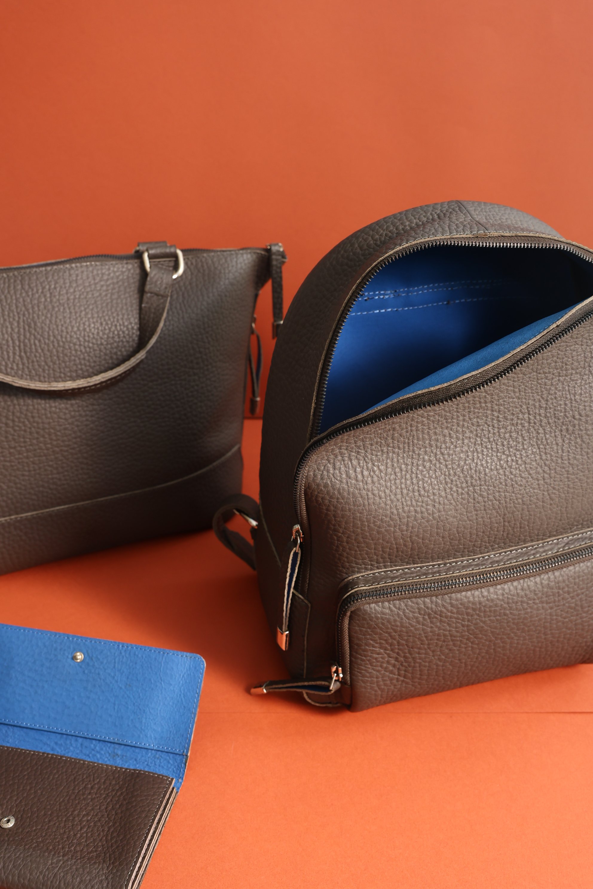Brown textured leather travel organizers and messenger bags